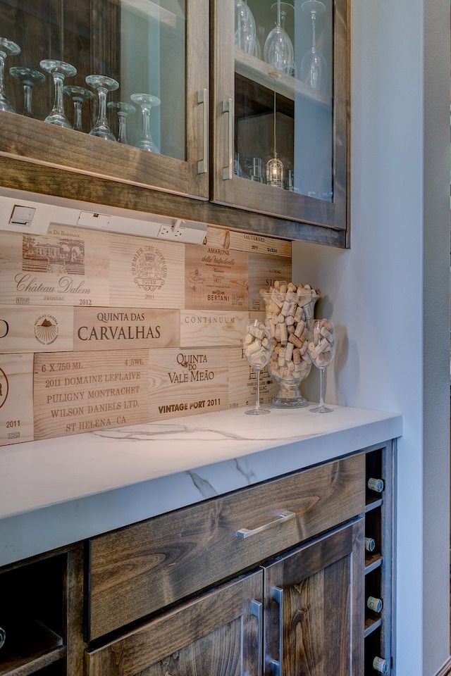 wet bar in hidden nook with wine theme and wine rack